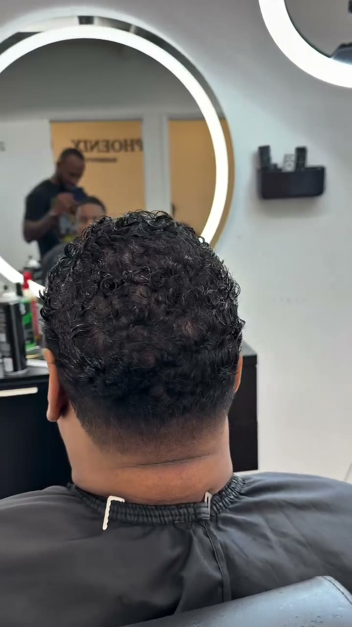 Barber at work in the Midtown studio